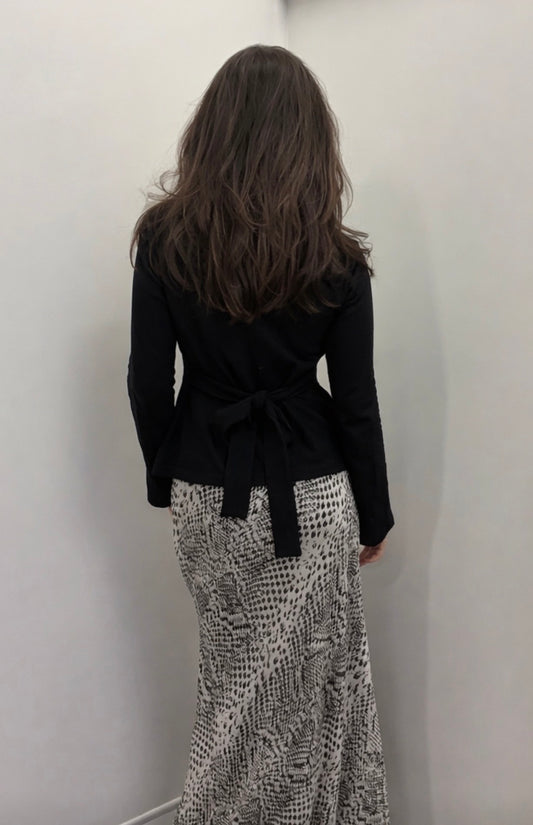 Black flared long sleeve cotton top with tie back detail
